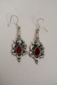 A pair of 925 silver earrings set with red stones, 5cm drop