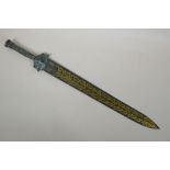 An archaic style Chinese bronze short sword with stylised dragon decoration, 63cm long