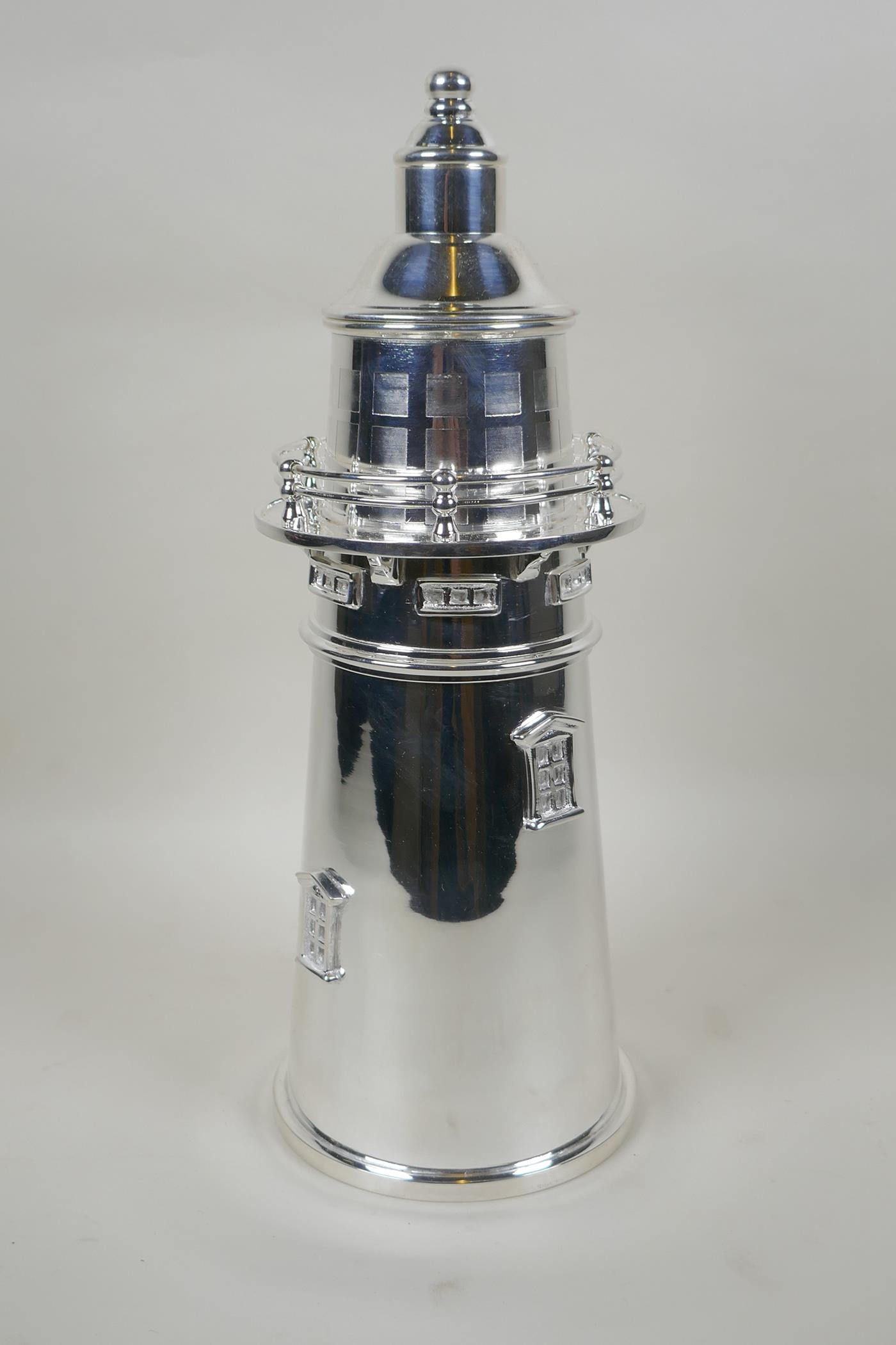 A silver plated cocktail shaker in the form of a lighthouse, 34cm high