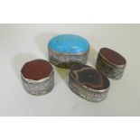 Three white metal pill boxes with inset agate tops, largest 4.5cm long, and another with turquoise