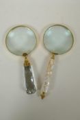 A brass mounted magnifying glass with mother of pearl handle, and another similar with glass handle,