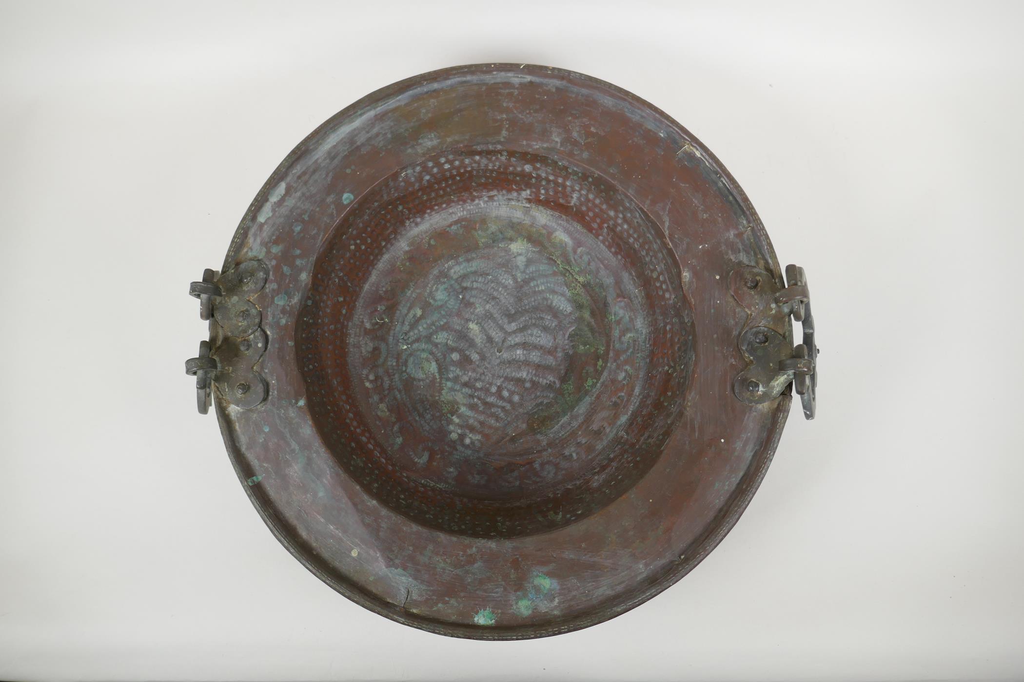 An antique oriental bronze handled copper brazier with hammered decoration, 42cm diameter - Image 2 of 4