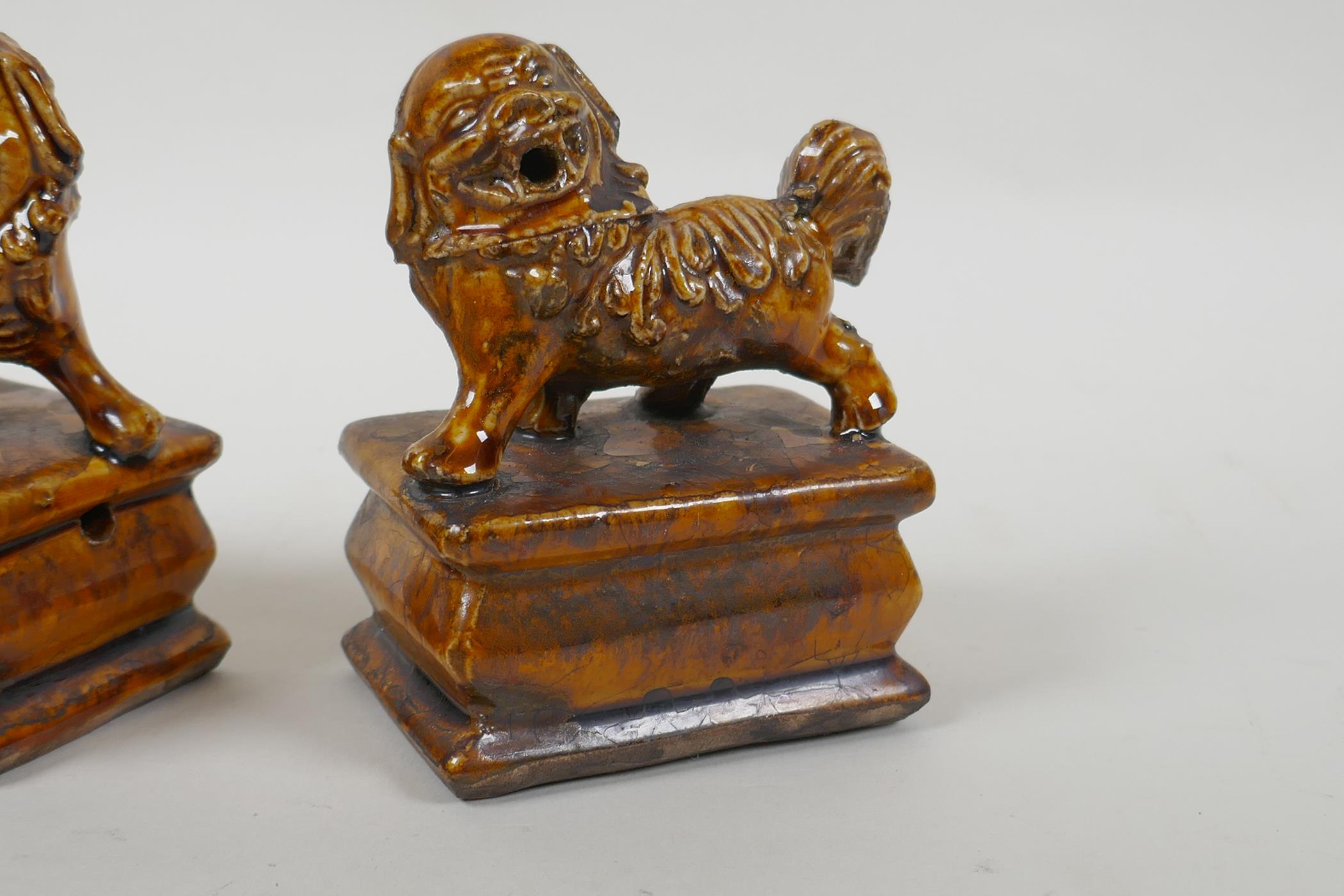 A pair of Chinese ochre glazed porcelain fo dogs, 10cm high - Image 2 of 5