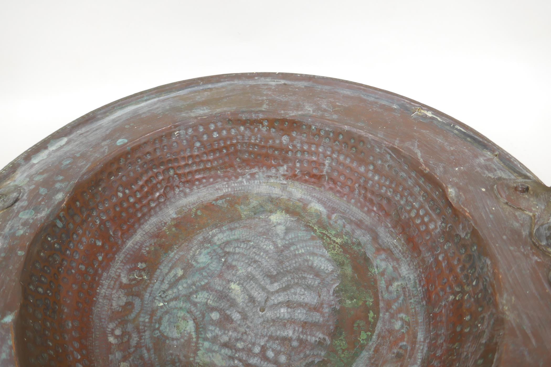 An antique oriental bronze handled copper brazier with hammered decoration, 42cm diameter - Image 3 of 4