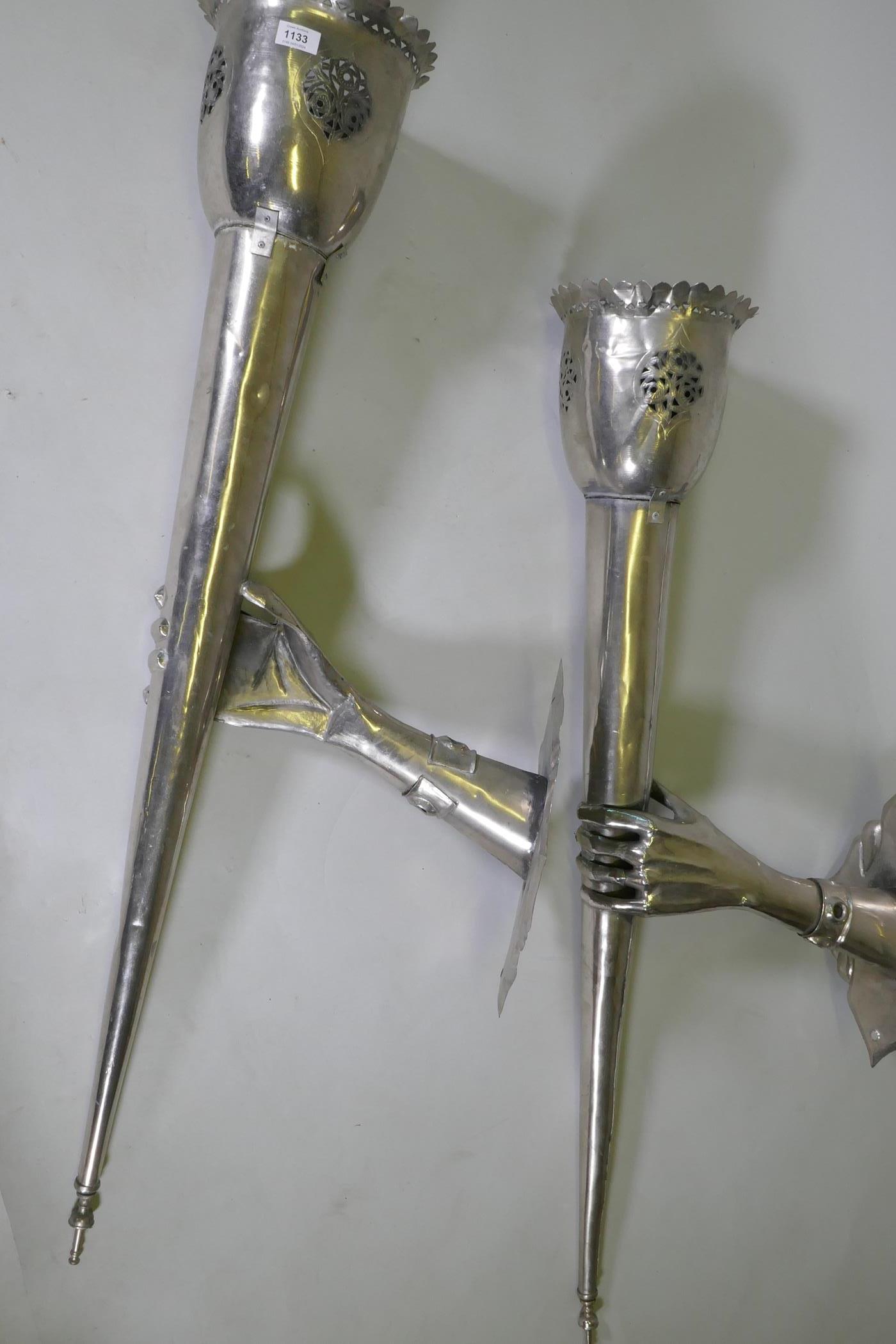 A pair of large white metal wall sconces in the form of a hand bearing a torch, 126 x 43cm - Image 3 of 4