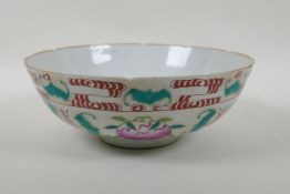 A Chinese Qing Dynasty famille rose porcelain bowl decorated with peaches, bats and auspicious