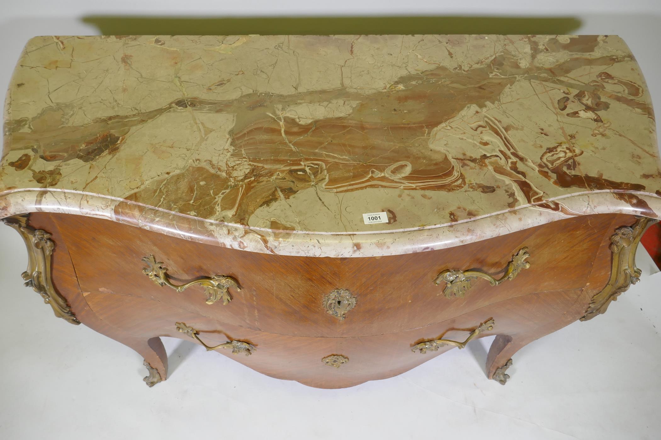 A French bombe shaped two drawer kingwood commode, with ormolu mounts and marble top, raised on - Image 5 of 6