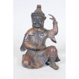 A Chinese bronze figure of an immortal, with red and gilt patination, impressed seal mark to base,