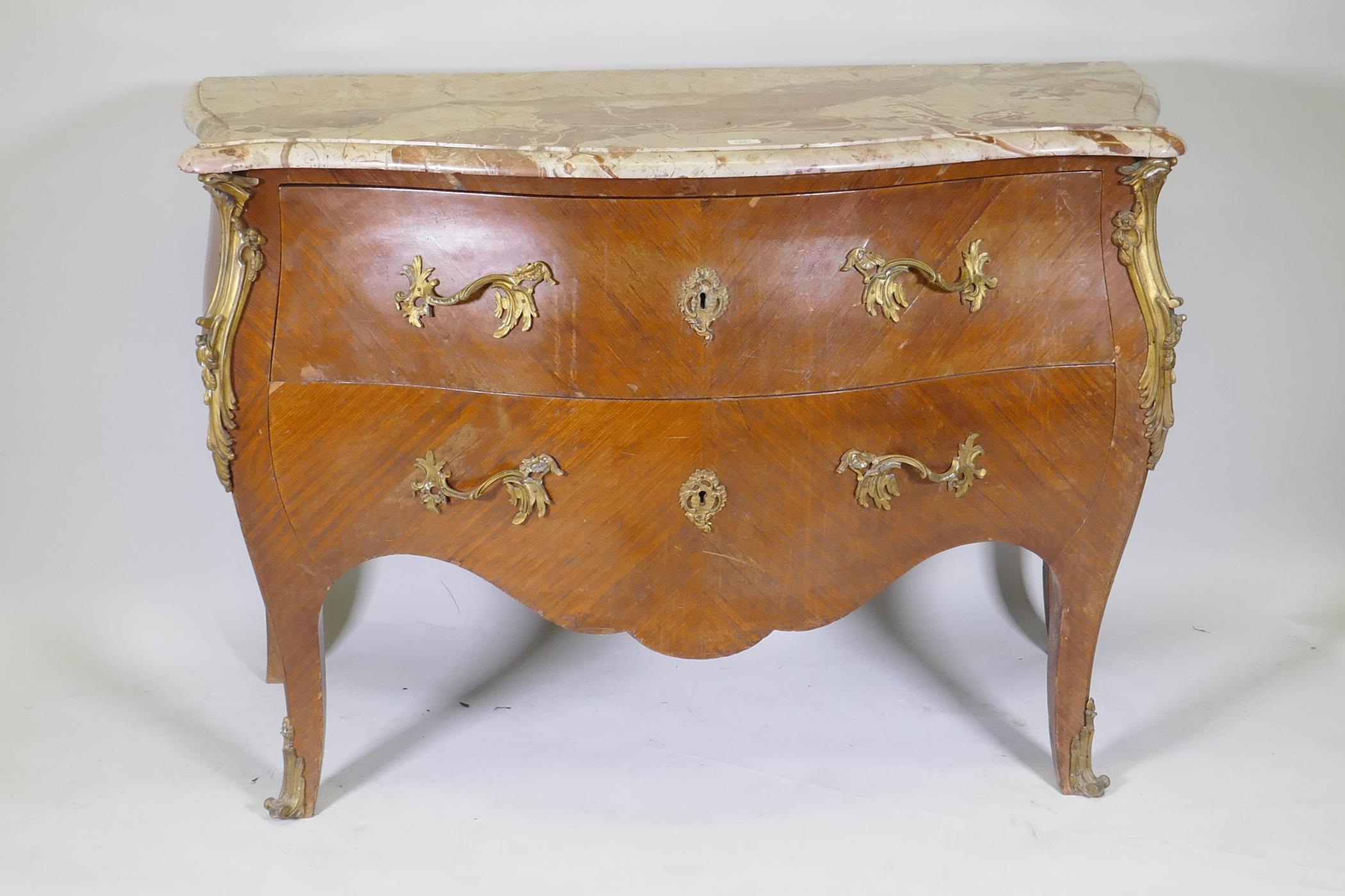 A French bombe shaped two drawer kingwood commode, with ormolu mounts and marble top, raised on - Image 2 of 6