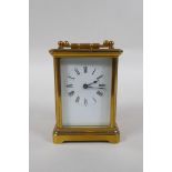 A brass cased carriage clock, the enamel dial with Roman numerals, 8 x 6cm, 11cm high