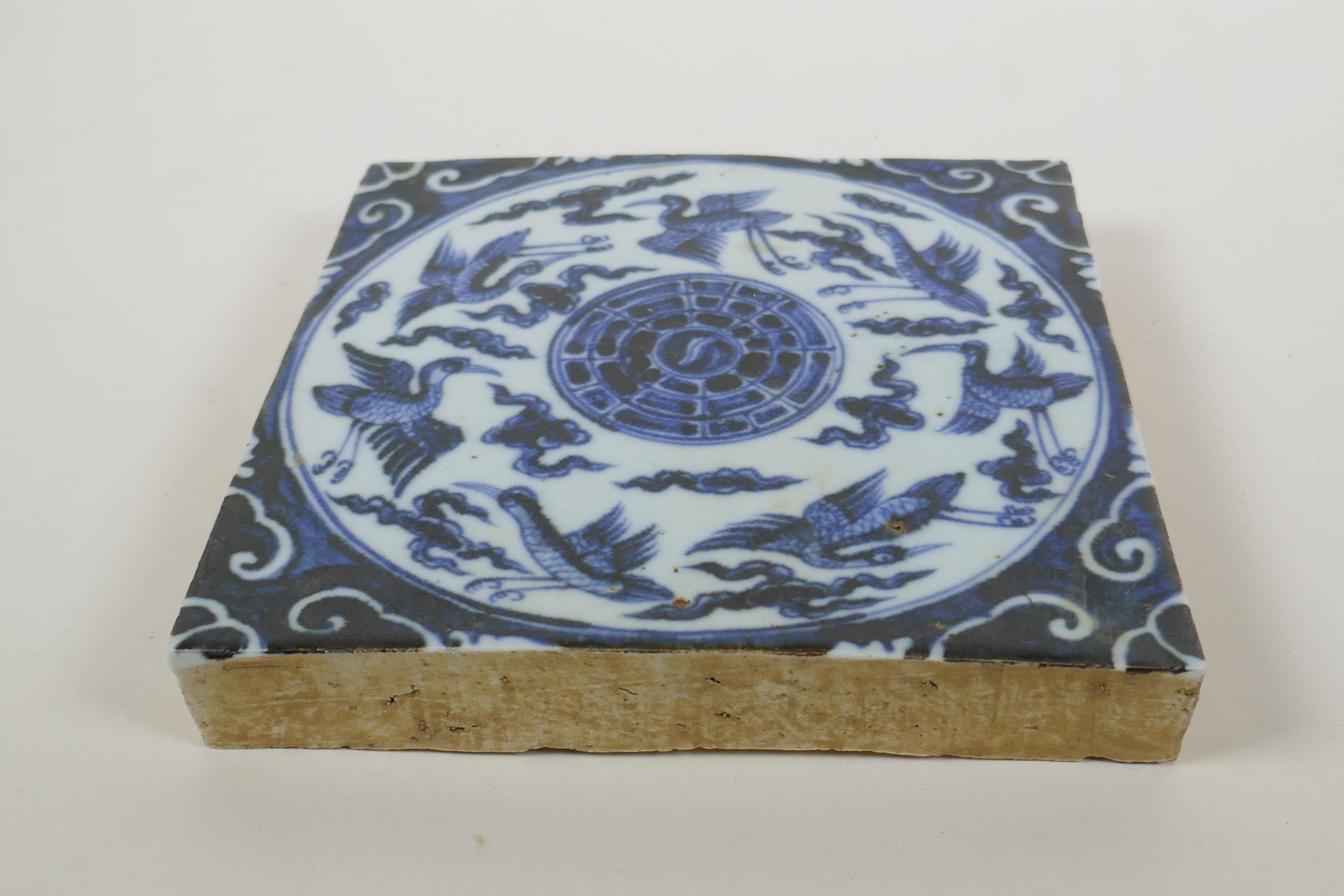 A Chinese blue and white porcelain temple tile decorated with ducks and the yin yang symbol, 20 x - Image 2 of 3