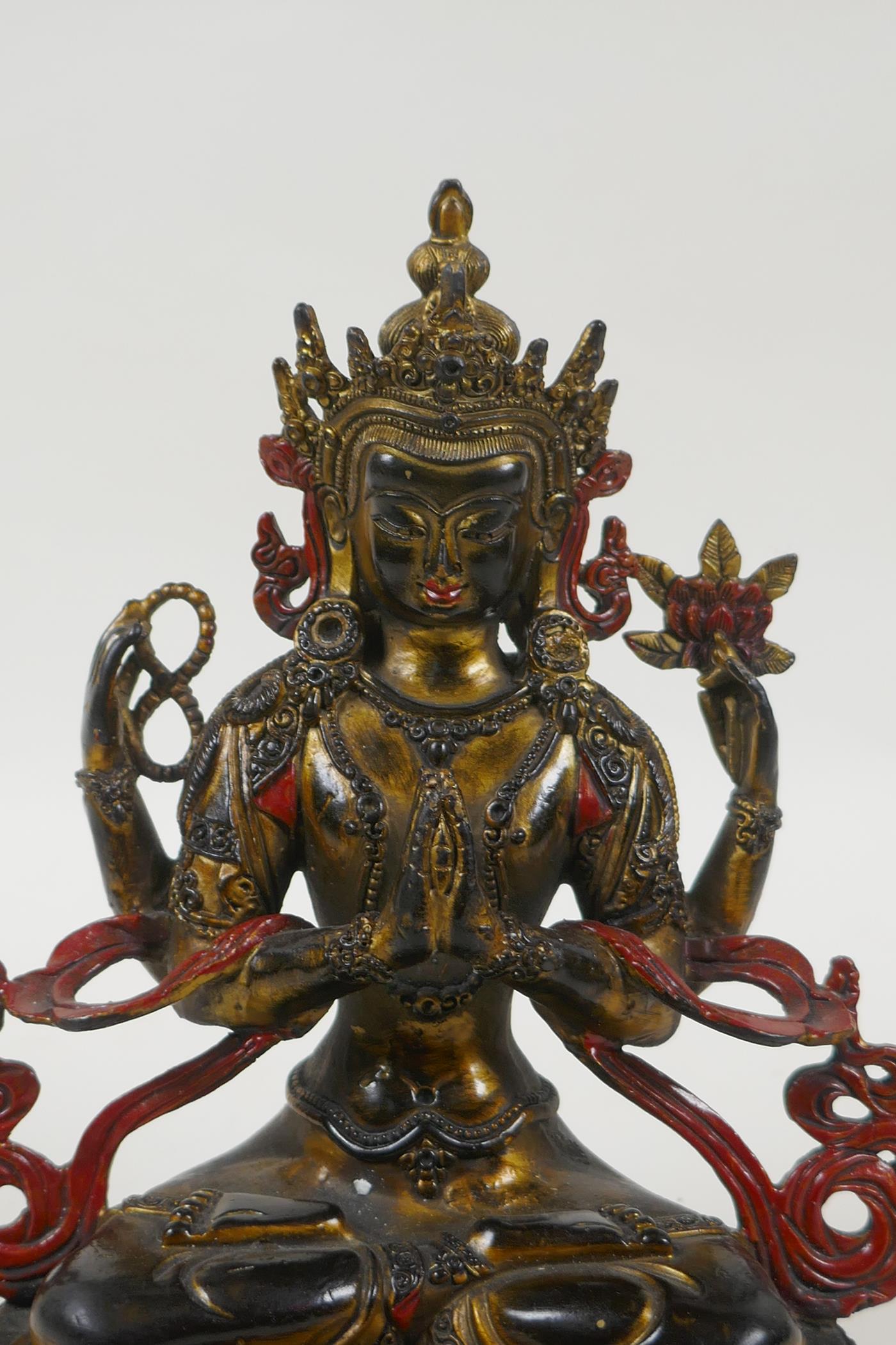 A Tibetan bronze figure of the Buddhist deity Chenrezig, with gilt and painted details, 21cm high - Image 2 of 4