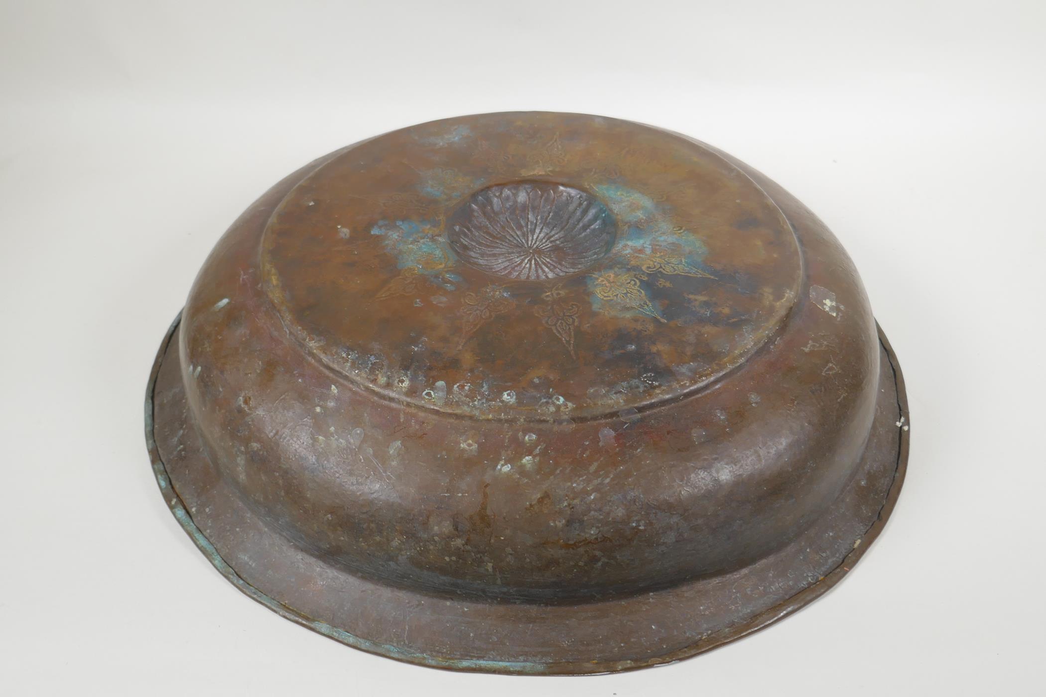 An antique Islamic gilt brass bowl with central boss and chased fish decoration, 46cm diameter - Image 5 of 5