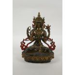 A Tibetan bronze figure of the Buddhist deity Chenrezig, with gilt and painted details, 21cm high