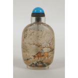 A Chinese reverse decorated glass snuff bottle decorated with figures and buffalo in a landscape,