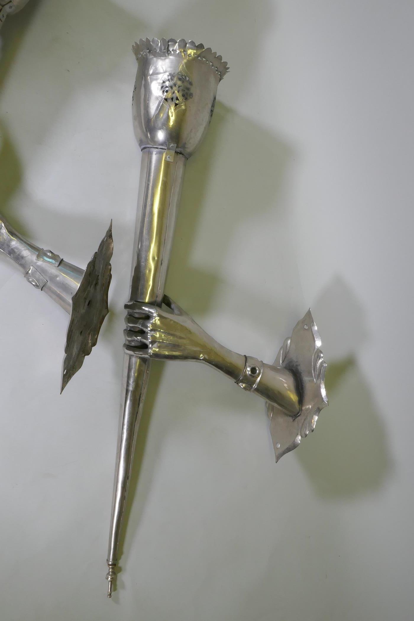 A pair of large white metal wall sconces in the form of a hand bearing a torch, 126 x 43cm - Image 2 of 4