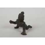 An antique Indian bronze of a crawling figure, 8cm long