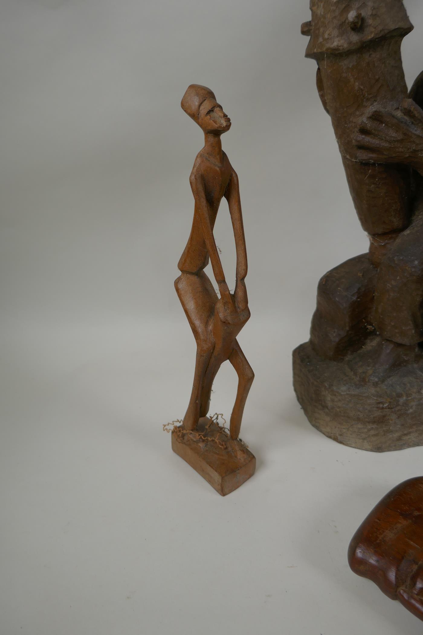 A collection of vintage African carved hardwood figures, largest 56cm high - Image 7 of 7