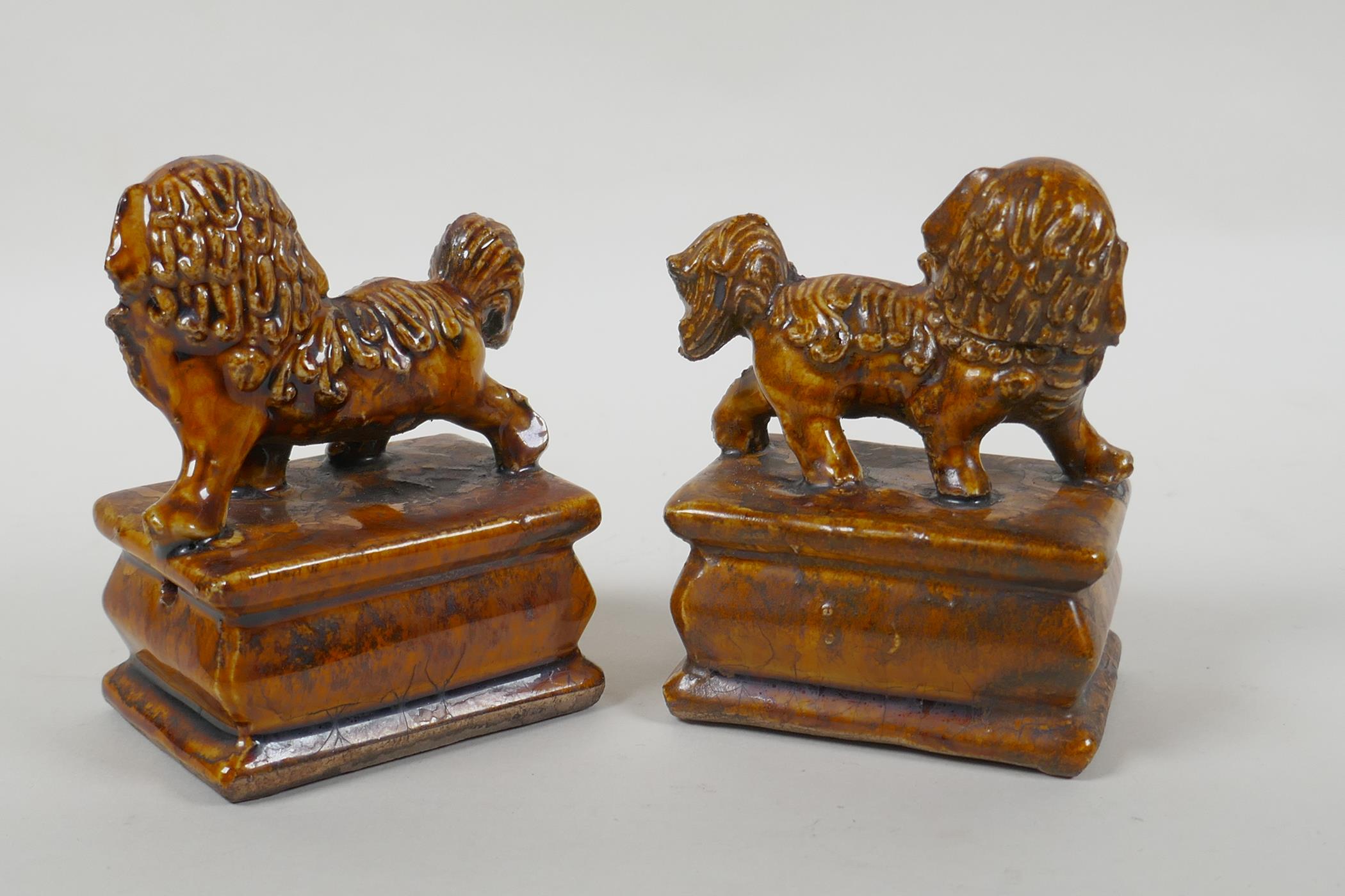 A pair of Chinese ochre glazed porcelain fo dogs, 10cm high - Image 4 of 5