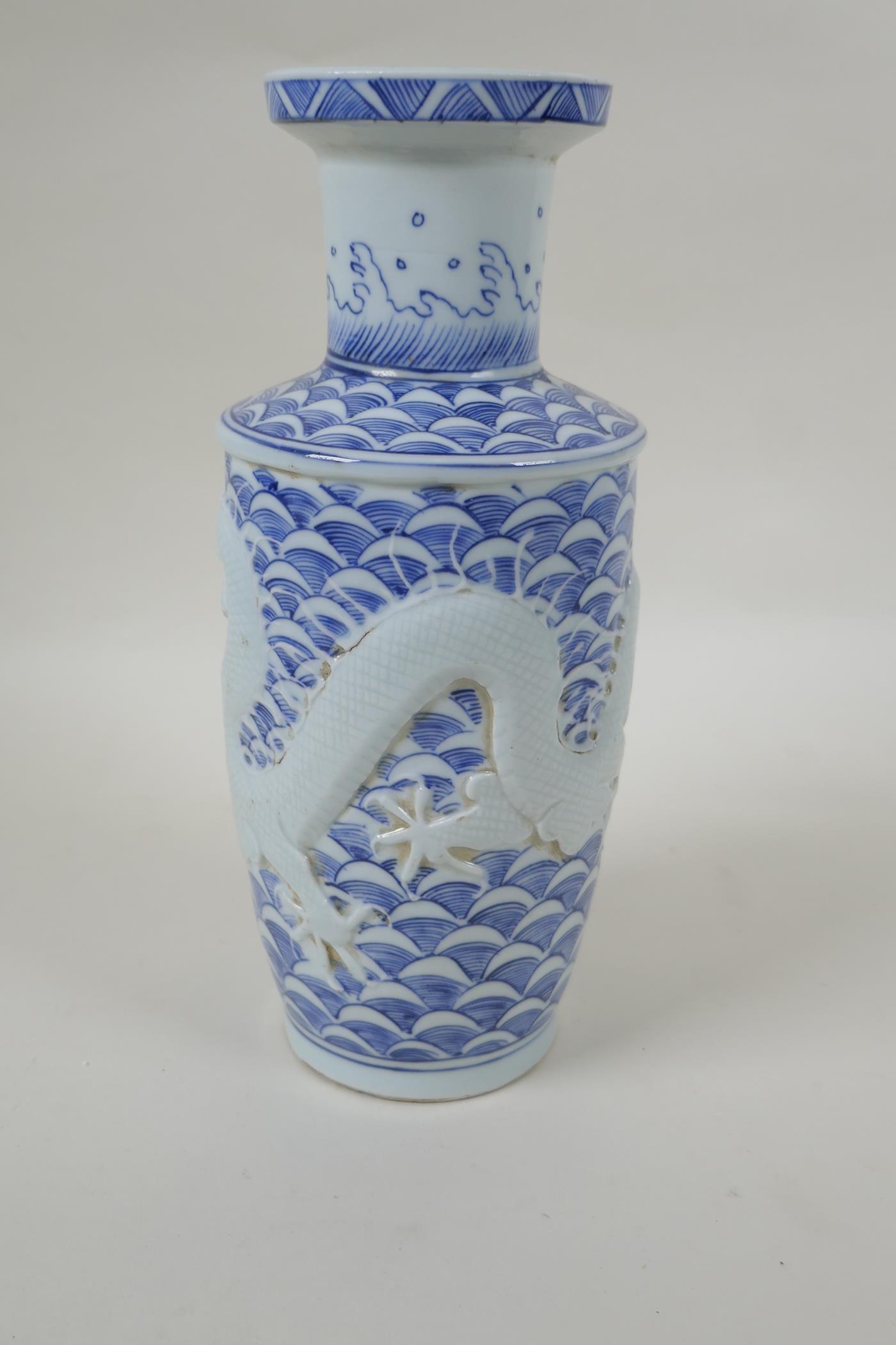 A Chinese blue and white porcelain vase with raised dragon decoration, impressed mark to base, - Image 2 of 5