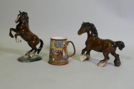 A Beswick figure of a leaping horse, No 1014, another of a cart horse, and a Beswick /Royal