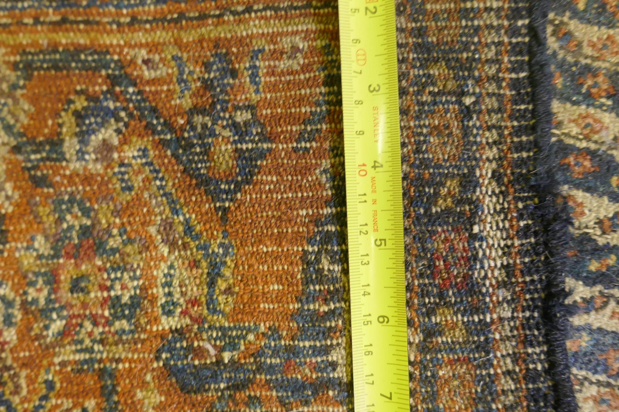 An antique Persian wool carpet with striped design and red borders, worn, 130 x 190 - Image 3 of 3