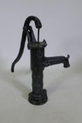 A painted cast iron water pump, 65cm high