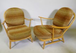 A pair of 1970s Ercol beech and elm Model 203 Windsor armchairs, with original upholstered cushions