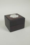 A Chinese hardwood box, the cover inset with carved and pierced celadon jade 'Fu' character, 9 x 9cm
