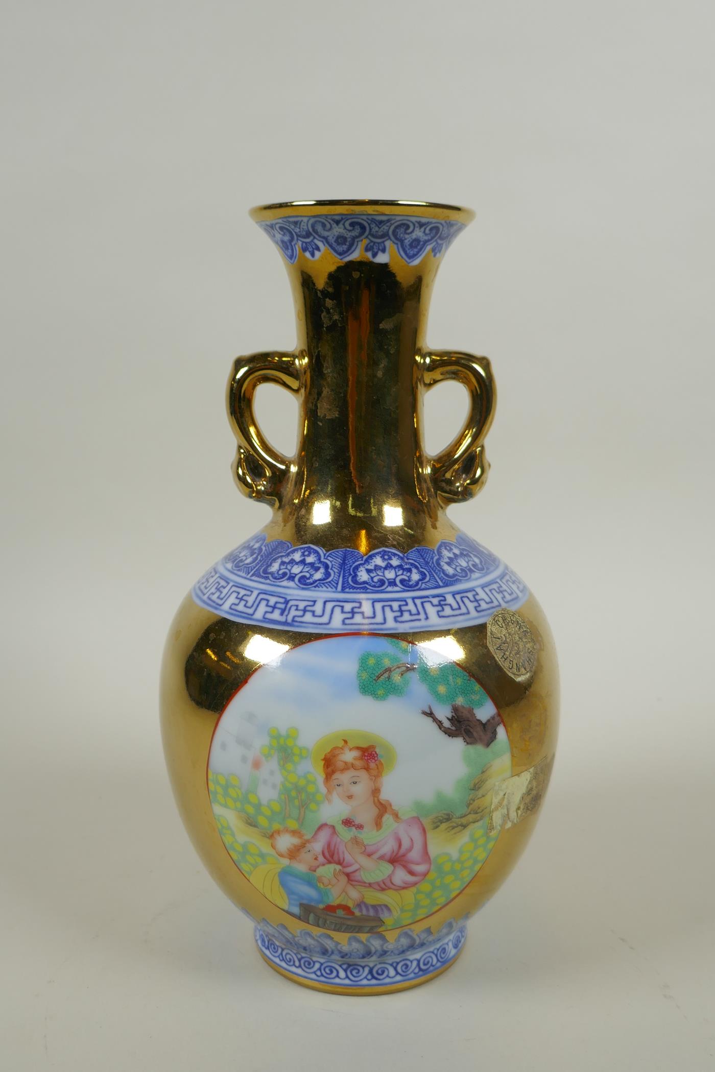 A Chinese gilt lustre and polychrome porcelain vase with two handles and decorative panels depicting