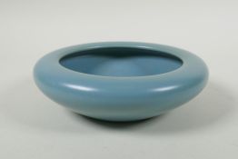 A Chinese celadon glazed porcelain dish with rolled rim, Wanli 6 character mark to base, 17cm