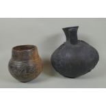 A Peruvian Chimu style Blackware double spout vessel, and another South American pottery vase,