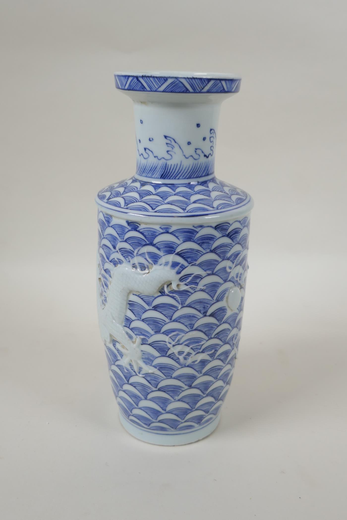 A Chinese blue and white porcelain vase with raised dragon decoration, impressed mark to base, - Image 3 of 5