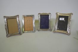Four Edwardian and later hallmarked silver photo frames, largest aperture 8 x13cm, two lack glass
