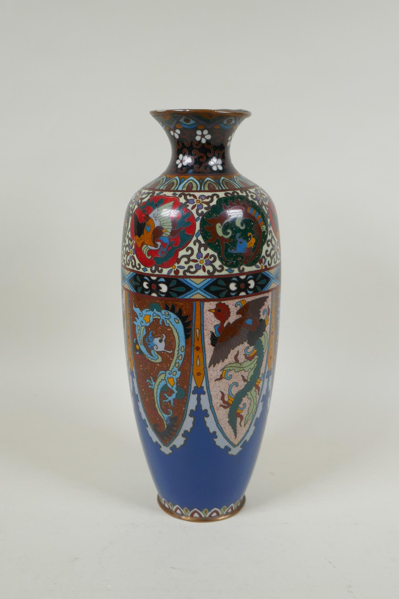 A Japanese Meiji period cloisonne vase with decorative panels depicting dragons and phoenix, 30cm