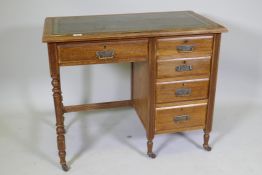 A Victorian mahogany five drawer desk, with leather inset top, raised on turned supports with