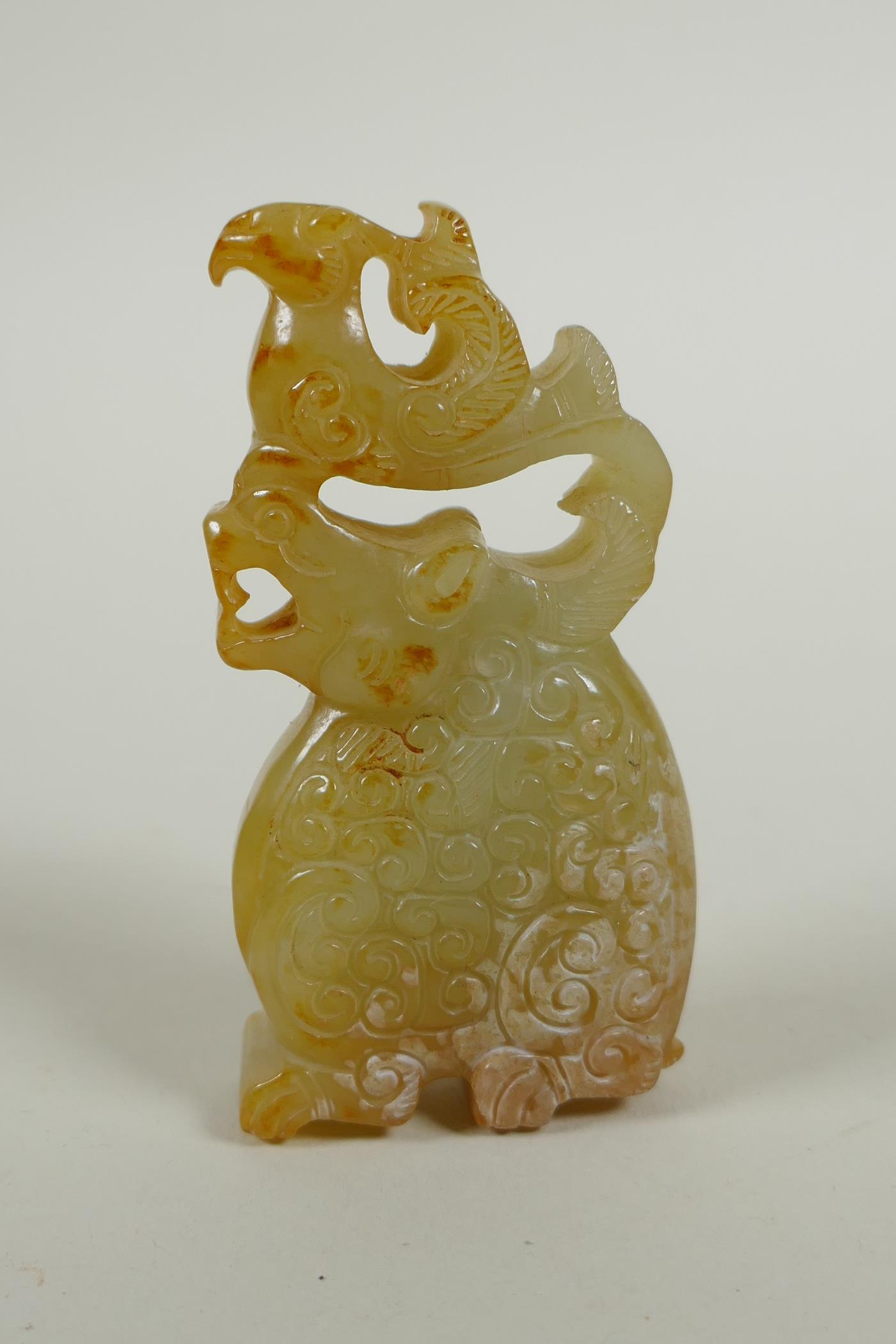 A Chinese carved and pierced jade pendant decoration with kylin and phoenix, 8cm high - Image 2 of 2