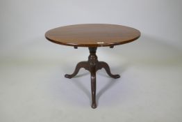 An antique mahogany tilt top table on tripod supports, reduced, 53cm high x 76cm diameter