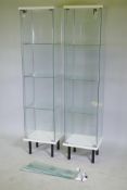 A pair of contemporary glass display cabinets with shelves, 43 x 37cm, 182cm high