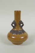 An antique Chinese crackleware bottle vase with two lion mask loop handles, 13cm high