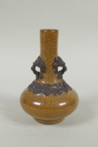 An antique Chinese crackleware bottle vase with two lion mask loop handles, 13cm high