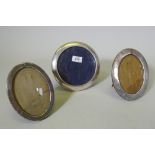 Two Edwardian hallmarked silver oval photo frames and a Continental silver frame, aperture