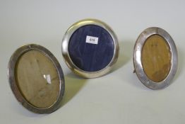 Two Edwardian hallmarked silver oval photo frames and a Continental silver frame, aperture