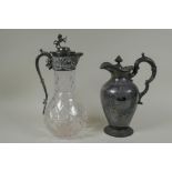 An antique silver plated and cut glass claret jug with a rampant lion knop, and a Walker and Hall