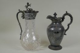 An antique silver plated and cut glass claret jug with a rampant lion knop, and a Walker and Hall