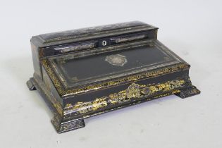 A Victorian black lacquered papier mache writing slope, decorated in gilt and inlaid abalone shards,