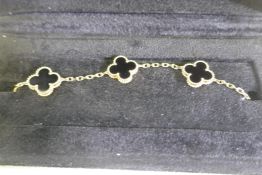 A Van Cleef & Arpels Alhambra motif bracelet, 18ct gold set with black onyx, with C.O.A. No JA670731