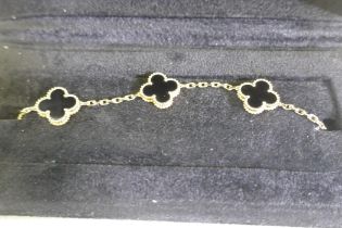 A Van Cleef & Arpels Alhambra motif bracelet, 18ct gold set with black onyx, with C.O.A. No JA670731