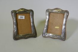 A pair of antique hallmarked silver photo frames, aperture 13 x 9cm