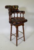 A captain's style buttoned oxblood leather stool, 118cm high